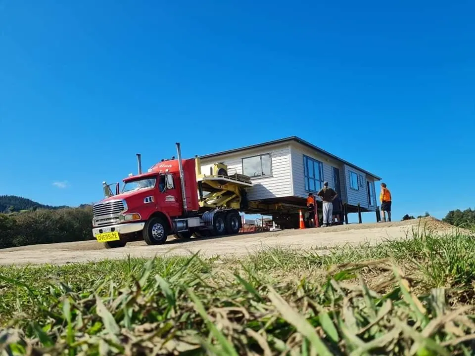 House Transporters crew on-site house delivery