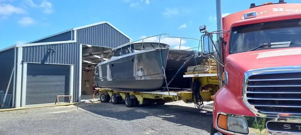 Heavy haulage transport of catamaran boat with Ole Red truck