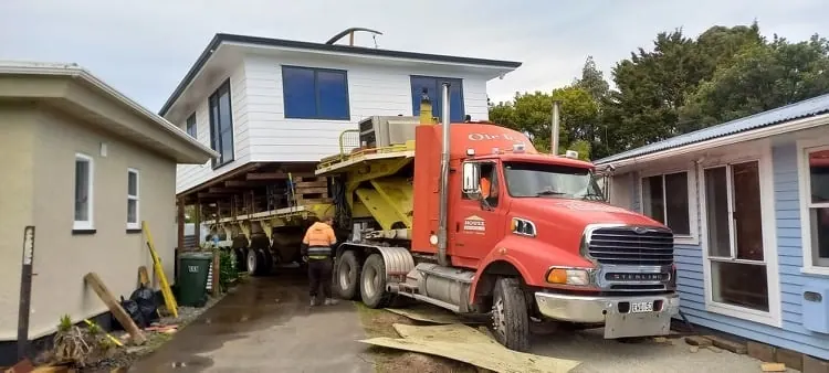 Precision maneuvering down tight residential driveway between buildings